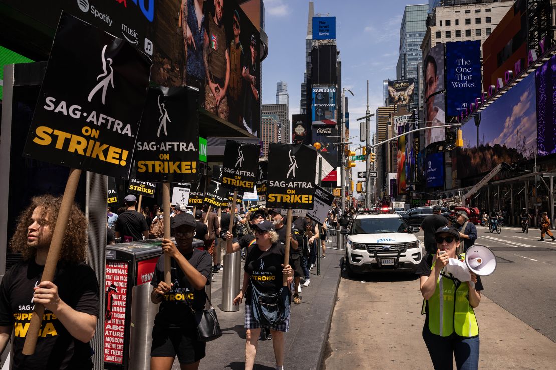 Screen Actors Guild members and supporters on a picket line in Times Square in New York, US, on Friday, July 14, 2023. For the first time in six decades, Hollywood writers and actors are on strike at the same time - a cataclysm for hundreds of thousands of film and TV workers already idled by the entertainment industry's growing labor strife. 