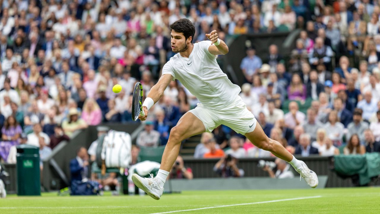 Carlos Alcaraz of Spain plays a shot at the net during his match against Daniil Medvedev of Russia in the Gentlemen's Singles semi-final match on Centre Court during the Wimbledon Lawn Tennis Championships at the All England Lawn Tennis and Croquet Club at Wimbledon on July 14, 2023, in London, England.