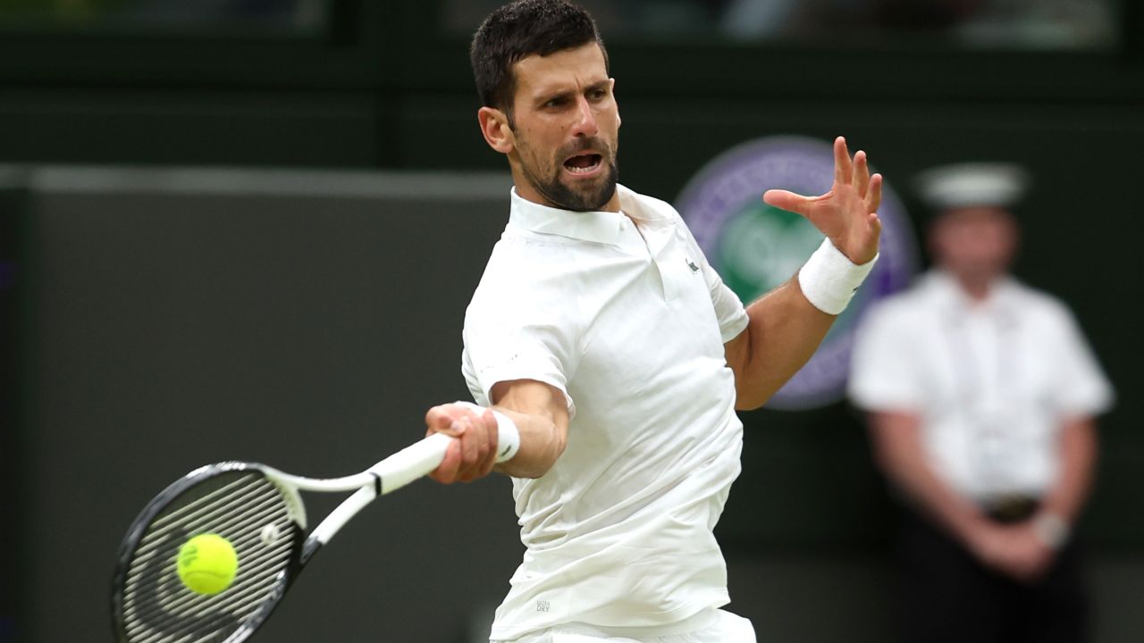 Novak Djokovic of Serbia plays a forehand against Jannik Sinner of Italy in the Men's Singles Semi Finals on day twelve of The Championships Wimbledon 2023 at All England Lawn Tennis and Croquet Club on July 14, 2023 in London, England.