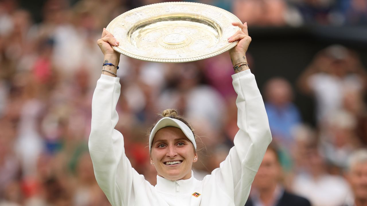 Marketa Vondrousova of Czech Republic lifts the Women's Singles Trophy as she celebrates victory following the Women's Singles Final against Ons Jabeur of Tunisia on day thirteen of The Championships Wimbledon 2023 at All England Lawn Tennis and Croquet Club on July 15, 2023 in London, England.