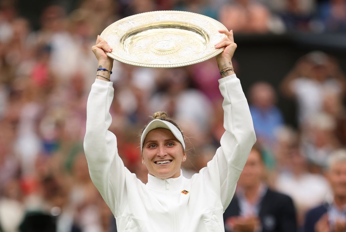 Marketa Vondrousova of Czech Republic lifts the Women's Singles Trophy as she celebrates victory following the Women's Singles Final against Ons Jabeur of Tunisia on day thirteen of The Championships Wimbledon 2023 at All England Lawn Tennis and Croquet Club on July 15, 2023 in London, England.