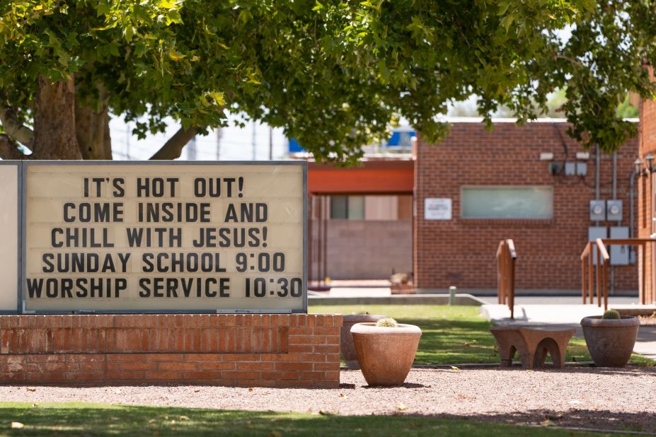 A sign warning of extreme heat invites people to "Chill with Jesus" inside a church in Tucson, Arizona, on July 15.