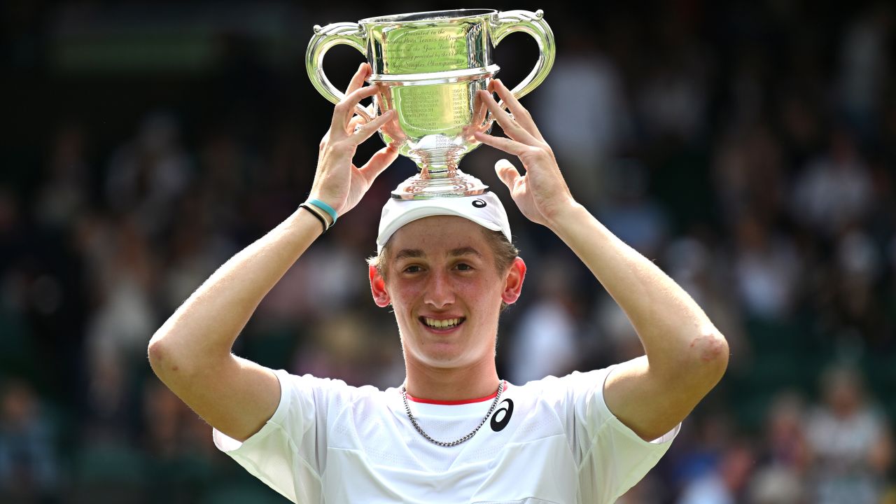 Henry Searle of Great Britain celebrates with the Boy's Singles Trophy following victory in the Boy's Singles Final against Yaroslav Demin on day fourteen of The Championships Wimbledon 2023 at All England Lawn Tennis and Croquet Club on July 16, 2023 in London, England.