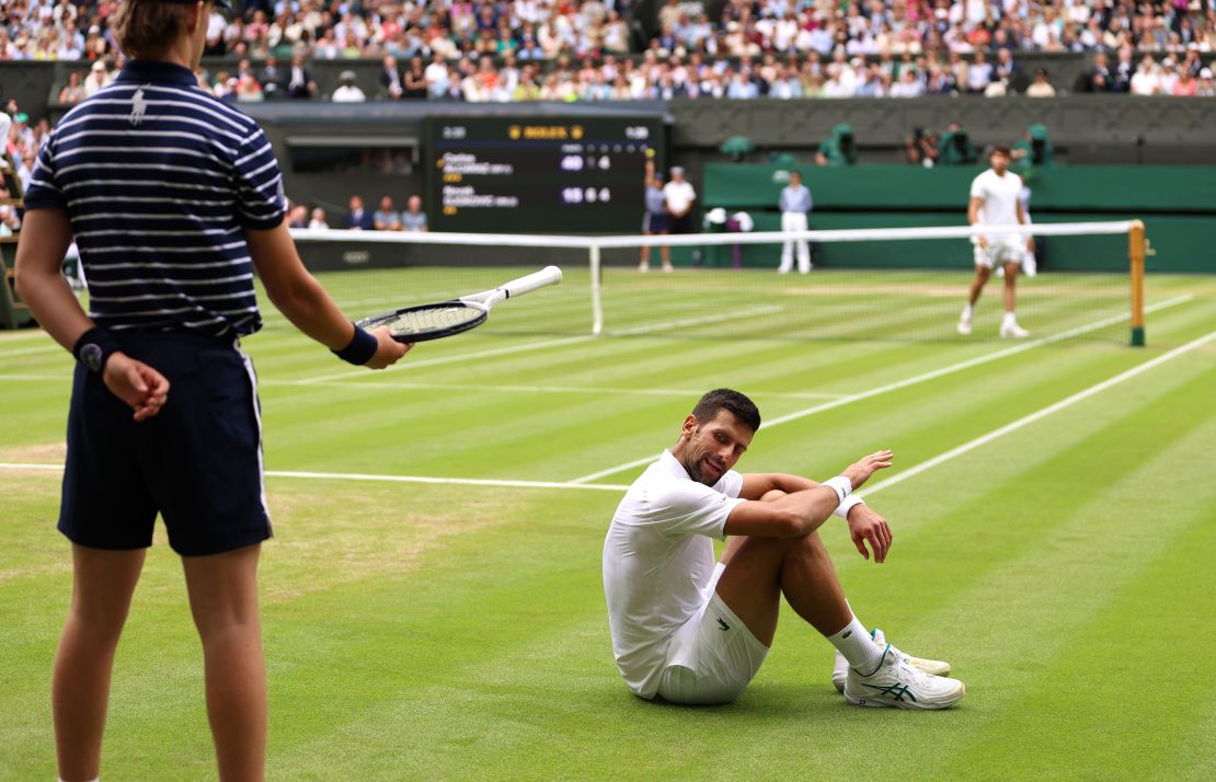 Novak Djokovic of Serbia reacts after falling in the Men's Singles Final against Carlos Alcaraz of Spain on day fourteen of The Championships Wimbledon 2023 at All England Lawn Tennis and Croquet Club on July 16, 2023 in London, England.