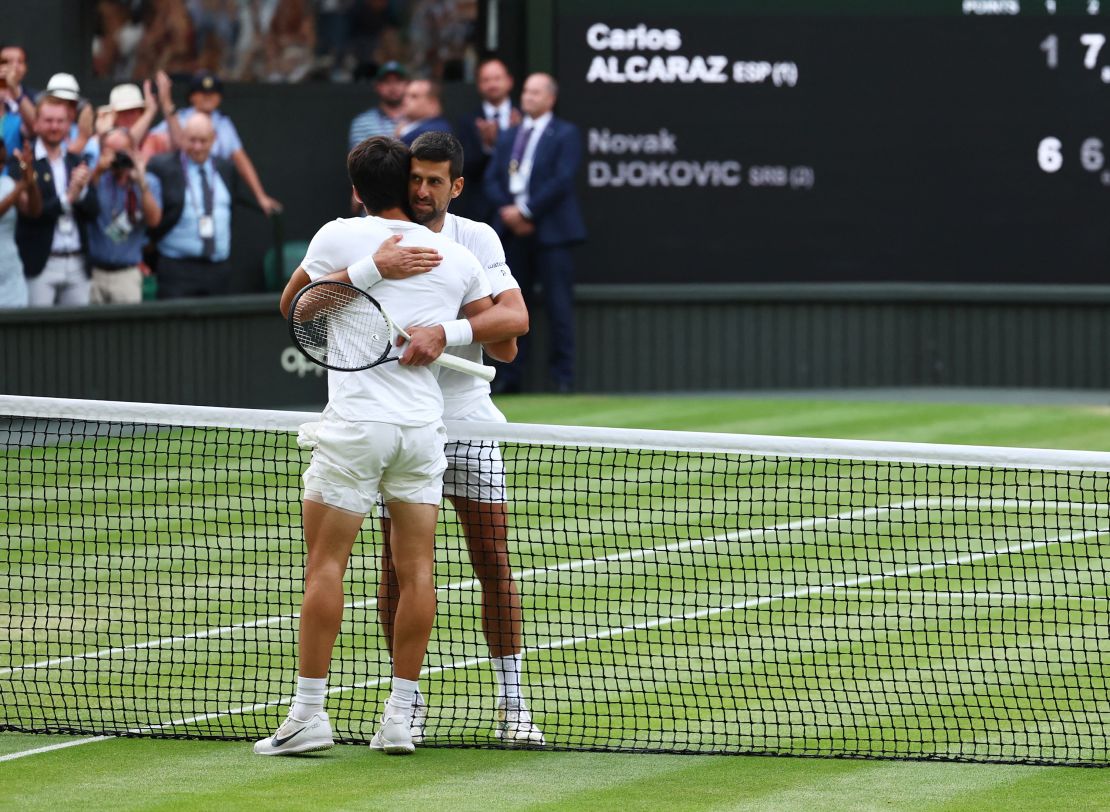 Tennis - Wimbledon - All England Lawn Tennis and Croquet Club, London, Britain - July 16, 2023
Spain's Carlos Alcaraz with Serbia's Novak Djokovic after winning the final
