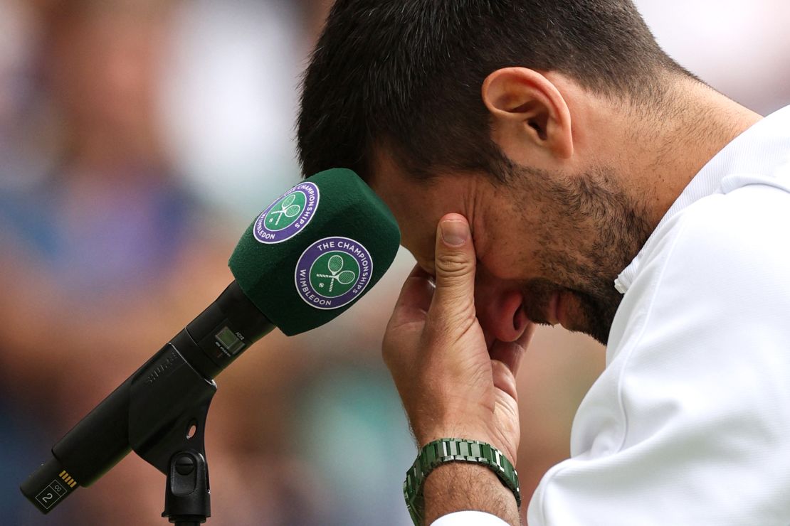 Serbia's Novak Djokovic reacts as he speaks to the crowd after being defeated by Spain's Carlos Alcaraz during their men's singles final tennis match on the last day of the 2023 Wimbledon Championships at The All England Tennis Club in Wimbledon, southwest London, on July 16, 2023.