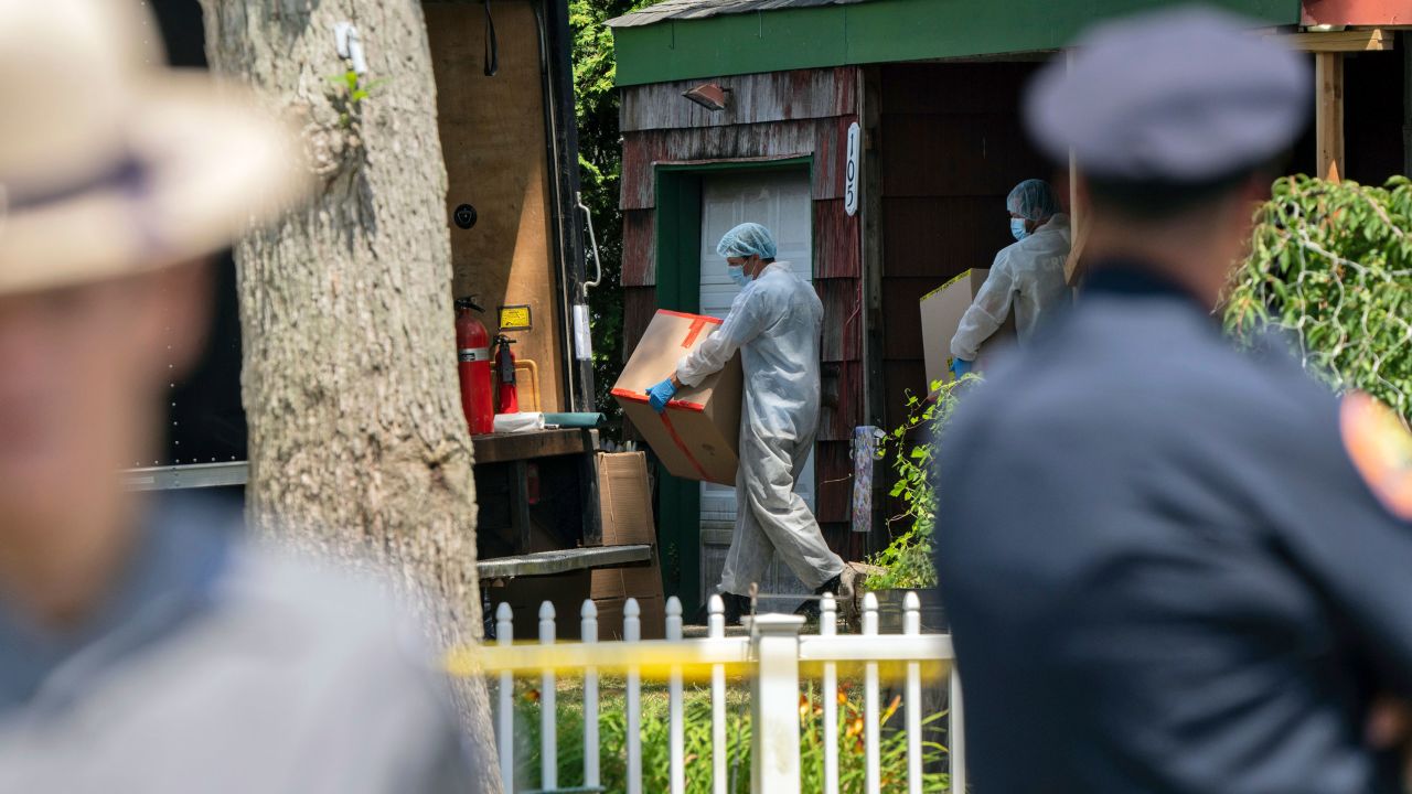 Crime laboratory officers removes boxes as law enforcement searches the home of Rex Heuermann, Saturday, July 15, 2023, in Massapequa Park, N.Y. Heuermann, a Long Island architect, was charged Friday, July 14, with murder in the deaths of three of the 11 victims in a long-unsolved string of killings known as the Gilgo Beach murders. (AP Photo/Jeenah Moon)