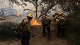 Firefighters clear the area to control the Gavilan Fire, which has already burned more than 250 acres in Perris, Riverside County, California, on July 15, 2023. Brutally high temperatures threatened tens of millions of Americans July 15, as numerous cities braced to break records under a relentless heat dome that has baked parts of the country all week.The National Weather Service warned of an "extremely hot and dangerous weekend," with daytime highs reaching up to 116 Fahrenheit (47 degres celsius). (Photo by DAVID SWANSON / AFP) (Photo by DAVID SWANSON/AFP via Getty Images)
