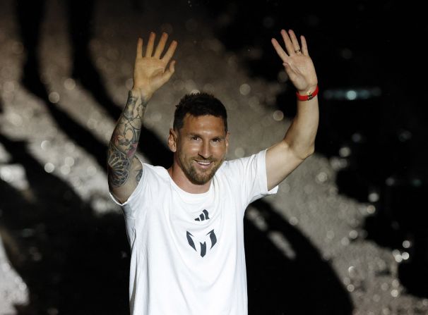 Messi waves to Inter Miami fans during his <a href="index.php?page=&url=https%3A%2F%2Fwww.cnn.com%2F2023%2F07%2F17%2Fsport%2Flionel-messi-inter-miami-unveil-spt-intl%2Findex.html" target="_blank">unveiling ceremony</a> in July 2023. He signed a contract with the club until the end of the 2025 MLS season. According to multiple reports, Messi's new deal includes an option for part-ownership of the club and a cut of revenue from new subscribers to Apple TV's MLS Season Pass streaming service.