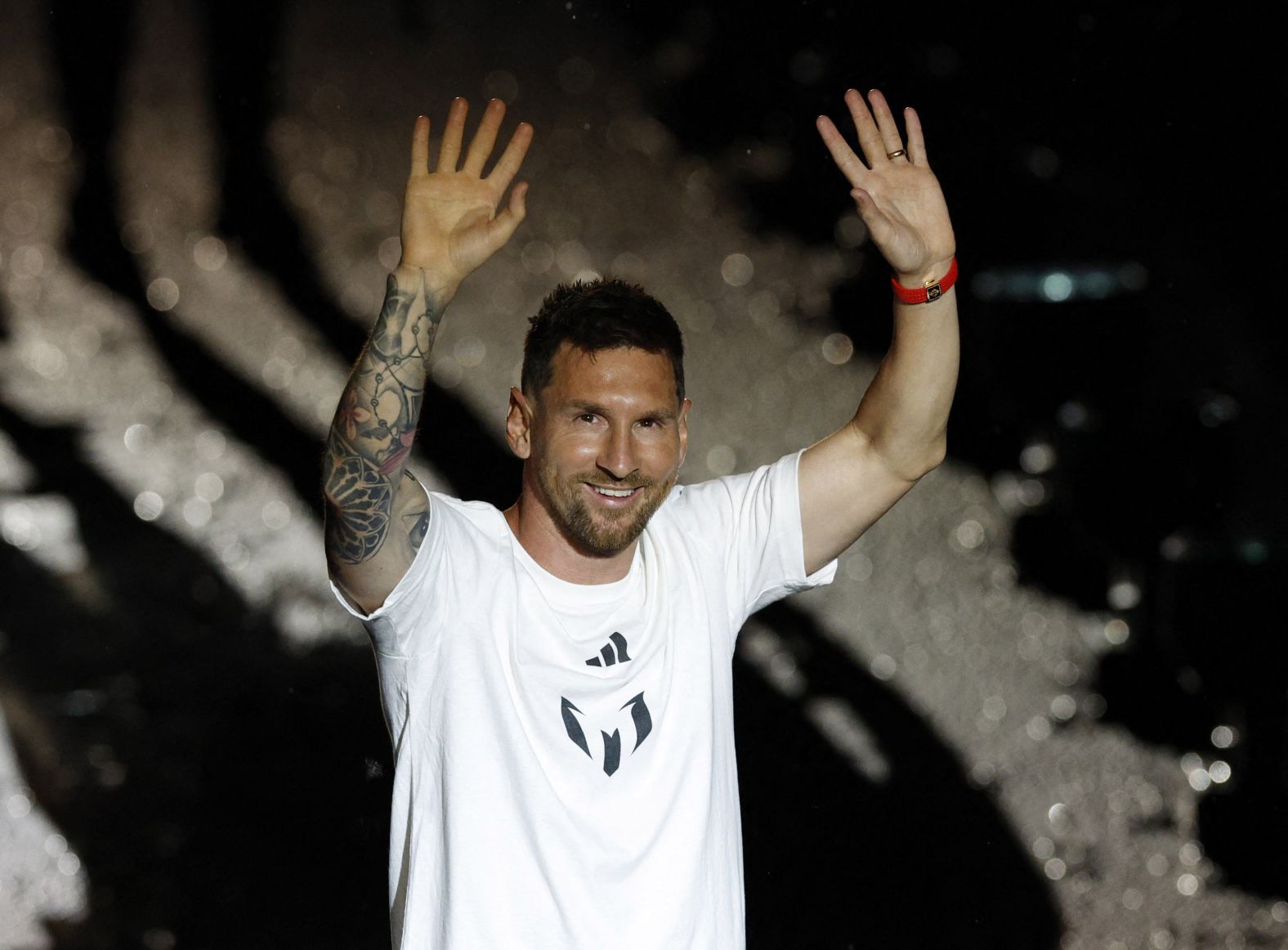 Messi waves to Inter Miami fans during his <a href="index.php?page=&url=https%3A%2F%2Fwww.cnn.com%2F2023%2F07%2F17%2Fsport%2Flionel-messi-inter-miami-unveil-spt-intl%2Findex.html" target="_blank">unveiling ceremony</a> in July 2023. He signed a contract with the club until the end of the 2025 MLS season. According to multiple reports, Messi's new deal includes an option for part-ownership of the club and a cut of revenue from new subscribers to Apple TV's MLS Season Pass streaming service.