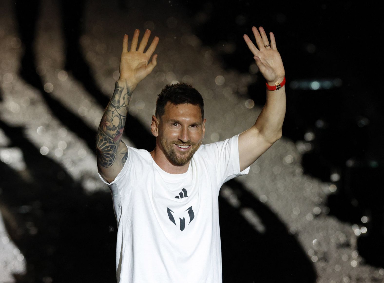 Messi waves to Inter Miami fans during his <a href="https://www.cnn.com/2023/07/17/sport/lionel-messi-inter-miami-unveil-spt-intl/index.html" target="_blank">unveiling ceremony</a> in July 2023. He signed a contract with the club until the end of the 2025 MLS season. According to multiple reports, Messi's new deal includes an option for part-ownership of the club and a cut of revenue from new subscribers to Apple TV's MLS Season Pass streaming service.