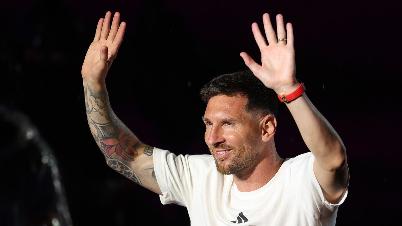 Lionel Messi waves to fans