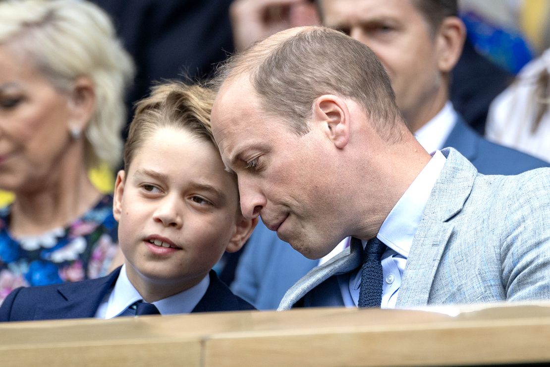 George and his father, Prince William (right), can be seen watching the tense match, which was decided in the fifth set.