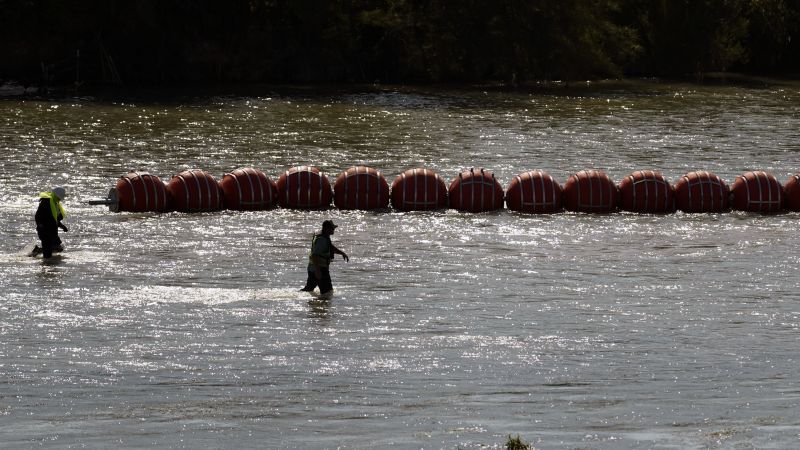 NextImg:Texas governor to defy DOJ request to remove floating barriers in Rio Grande: 'Texas will see you in court, Mr. President' | CNN Politics