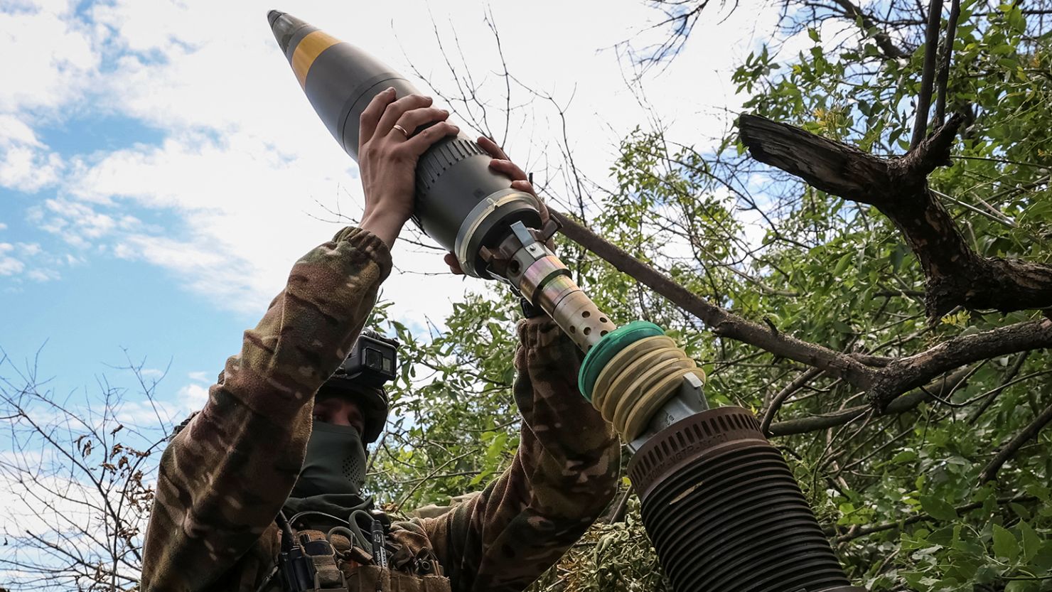A Ukrainian serviceman, of the 10th separate mountain assault brigade of the Armed Forces of Ukraine, prepares to fire a mortar at their positions at a front line, amid Russia's attack on Ukraine, near the city of Bakhmut in Donetsk region, Ukraine July 13, 2023. 