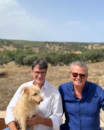 <strong>Slow process:</strong> "The build was supposed to last a year," says Proost, pictured with Andrew, left, and one of their dogs. "We just finished, which is almost three years. So it was a bit longer than originally planned."