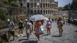ROME, ITALY - JULY 17: People cool off during an ongoing heat wave with temperatures reaching 44 degrees, at Colosseo area (Colosseum), on July 17, 2023 in Rome, Italy. The government has issued red alerts for 16 cities due to the current heatwave, which the Italian Meteorological Society named Cerberus, the mythical creature who guarded the gates of the underworld. Many places in Italy have seen successive days over 40C. (Photo by Antonio Masiello/Getty Images)