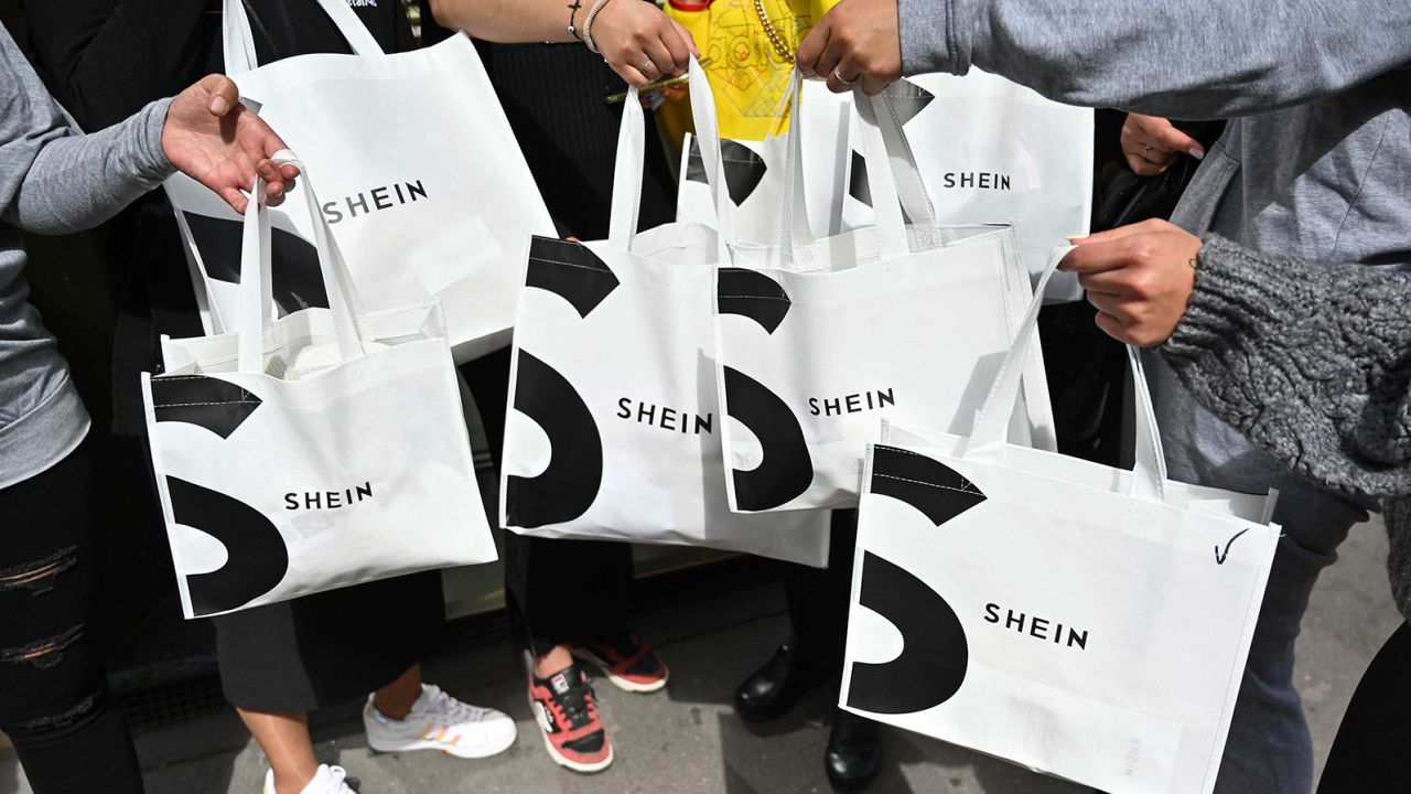 Consumers holding Shein shopping bags in Paris in May.