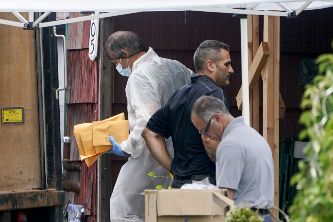 Authorities remove evidence from the Massapequa Park, Long Island, home of suspect Rex Heuermann on Tuesday, July 18.