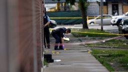 CHICAGO, IL - AUGUST 5 : Chicago Police officers and detectives investigate a shooting where multiple people were shot on Sunday, August 5, 2018 in Chicago, Illinois. In the last 24 hours over 30 people have been shot and at least 2 killed across Chicago including five mass shootings, where four or more victims were shot at one location. (Photo by Joshua Lott/Getty Images)