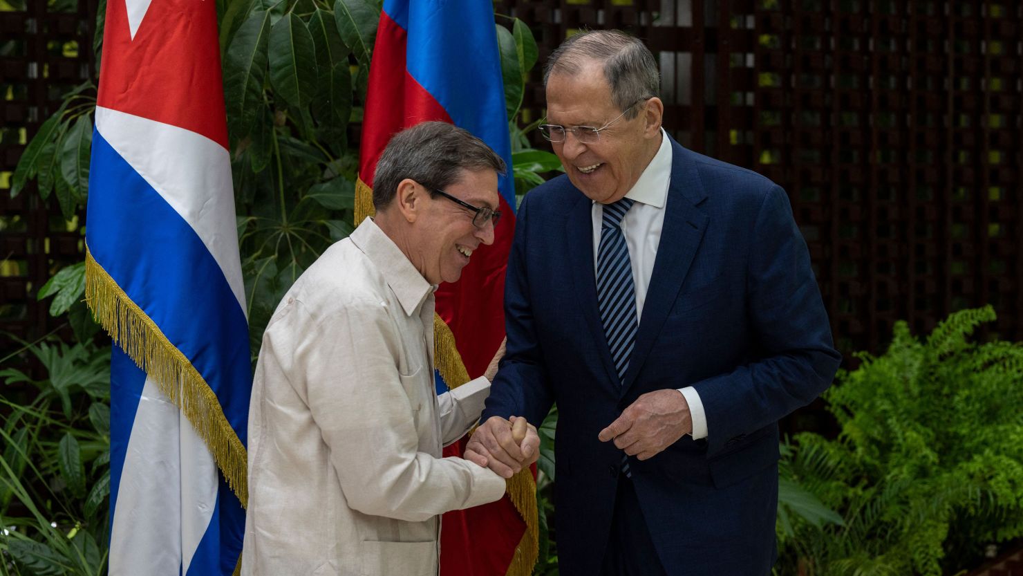 Russian Foreign Minister Sergey Lavrov (R) and Cuba's Minister of Foreign Affairs, Bruno Rodriguez, shake hands during a meeting in Havana on April 20, 2023. (Photo by Ramon Espinosa / POOL / AFP) (Photo by RAMON ESPINOSA/POOL/AFP via Getty Images)
