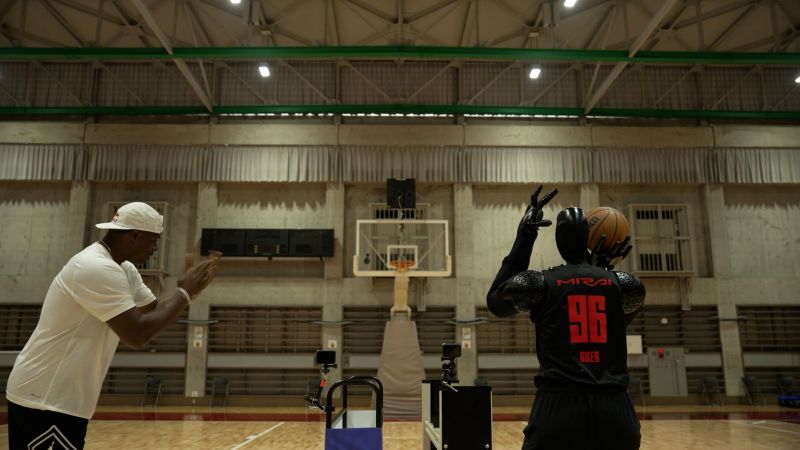 Watch the Guinness World record holder robot compete against NBA shooting coach | CNN