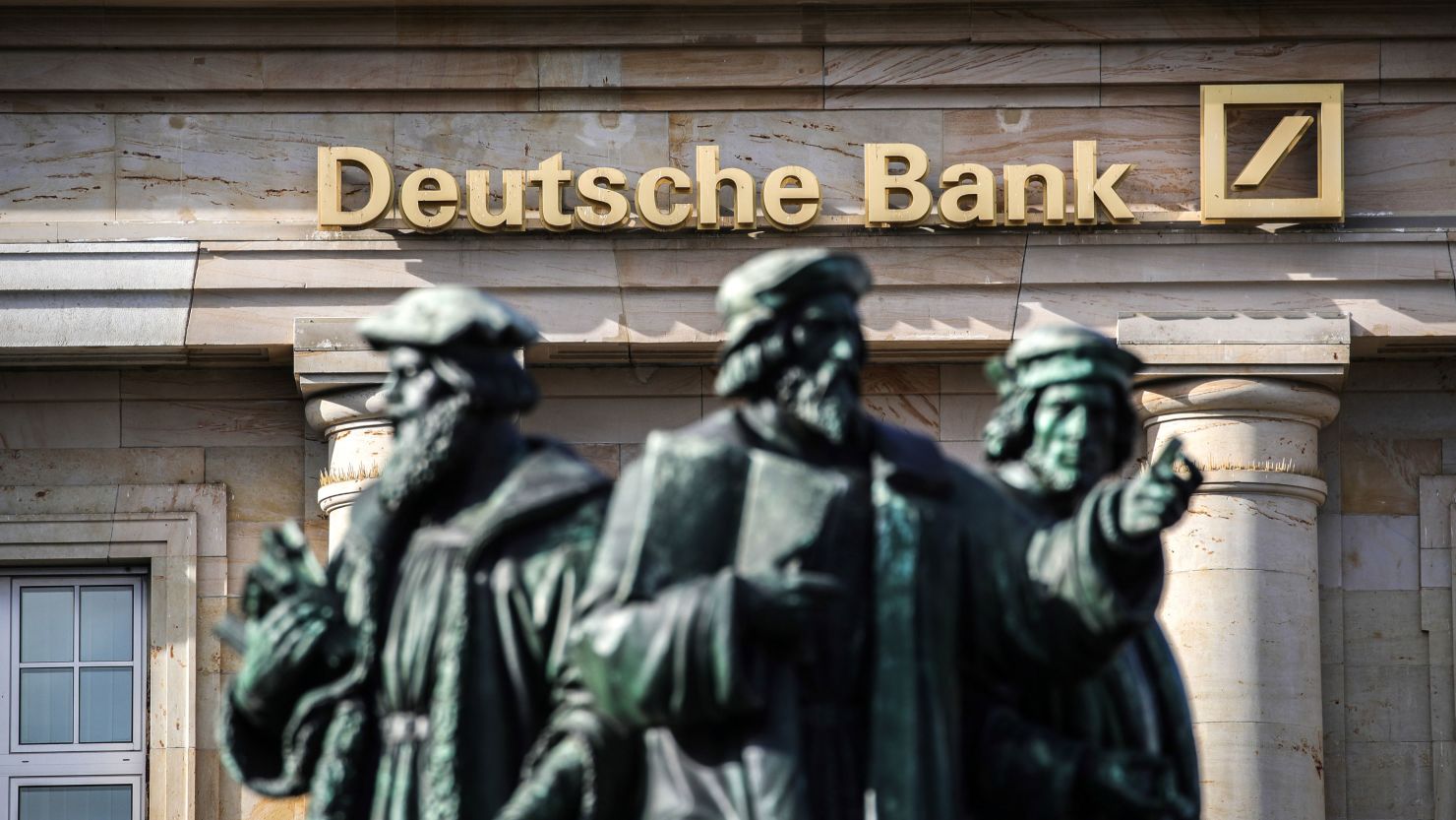 The logo of German giant Deutsche Bank is seen on one of their branches in Frankfurt am Main, western Germany, on February 4, 2021, as the bank publishes its preliminary results for the 2020 financial year. - Deutsche Bank posted on February 4 its first annual profit in six years, boosted by strong gains at its investment banking division, the one time problem child of the business. Net profit for 2020 reached 113 million euros, while for the fourth quarter of the year, net earnings came in at 51 million euros. (Photo by Armando BABANI / AFP) (Photo by ARMANDO BABANI/AFP via Getty Images)
