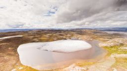 Melting ice on a small tundra pond in Greenland.