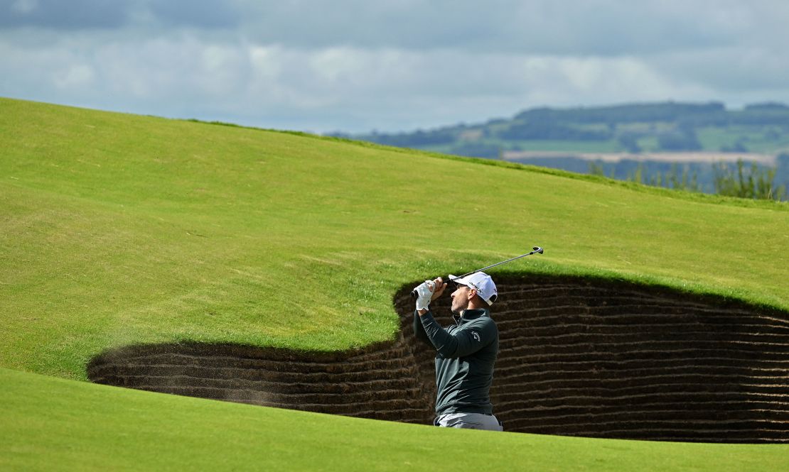 TOPSHOT - England's Oliver Wilson plays out of a bunker on the 17th hole during a practice round for 151st British Open Golf Championship at Royal Liverpool Golf Course in Hoylake, north west England on July 19, 2023. The Royal Liverpool Golf Course will host The 151st Open from July 20 to 23, 2023. (Photo by Glyn KIRK / AFP) / EDITORIAL USE ONLY (Photo by GLYN KIRK/AFP via Getty Images)