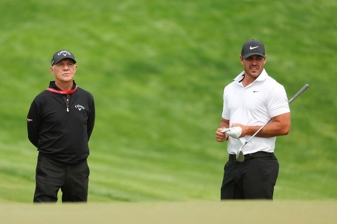 ROCHESTER, NEW YORK - MAY 16: Coach Pete Cowen and Brooks Koepka of the United States stand on the ninth hole during a practice round prior to the 2023 PGA Championship at Oak Hill Country Club on May 16, 2023 in Rochester, New York. (Photo by Kevin C. Cox/Getty Images)