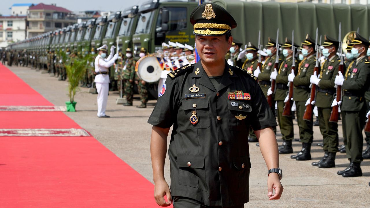 Hun Manet walks past an honour guard during a military ceremony in Phnom Penh on June 18, 2020.