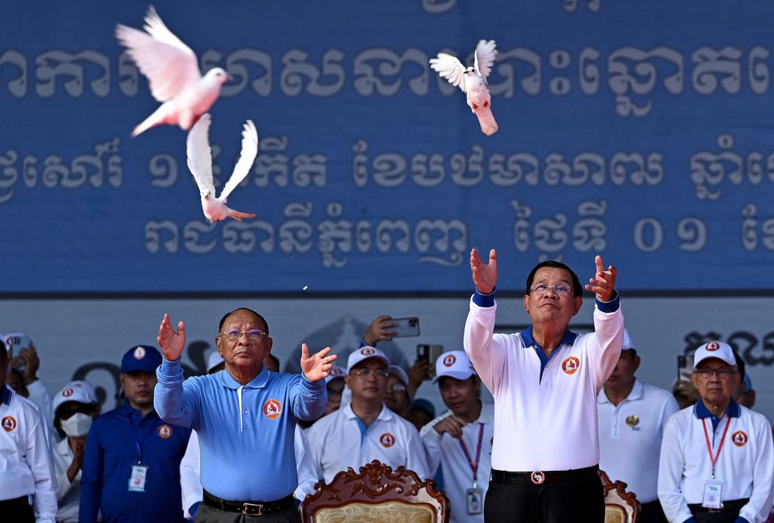 Cambodia's Prime Minister Hun Sen releases doves during a rally for the ruling Cambodian People's Party on July 1, 2023.