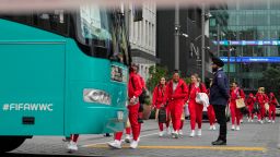 Members of the Philippines Women's World Cup team walk to their team bus following a shooting near their hotel in the central business district in Auckland, New Zealand, Thursday, July 20, 2023. A gunman killed two people before he died Thursday at a construction site in Auckland, as the nation prepared to host games in the FIFA Women's World Cup soccer tournament.(AP Photo/Abbie Parr)