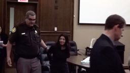 Celeste Burgess is handcuffed after her sentencing on July 20.