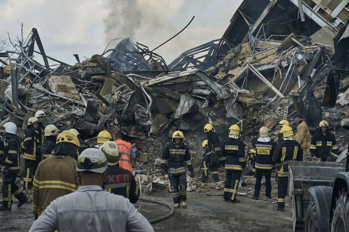 Emergency service personnel work at the site of a destroyed building after a Russian attack in Odesa, Ukraine, July 20, 2023.