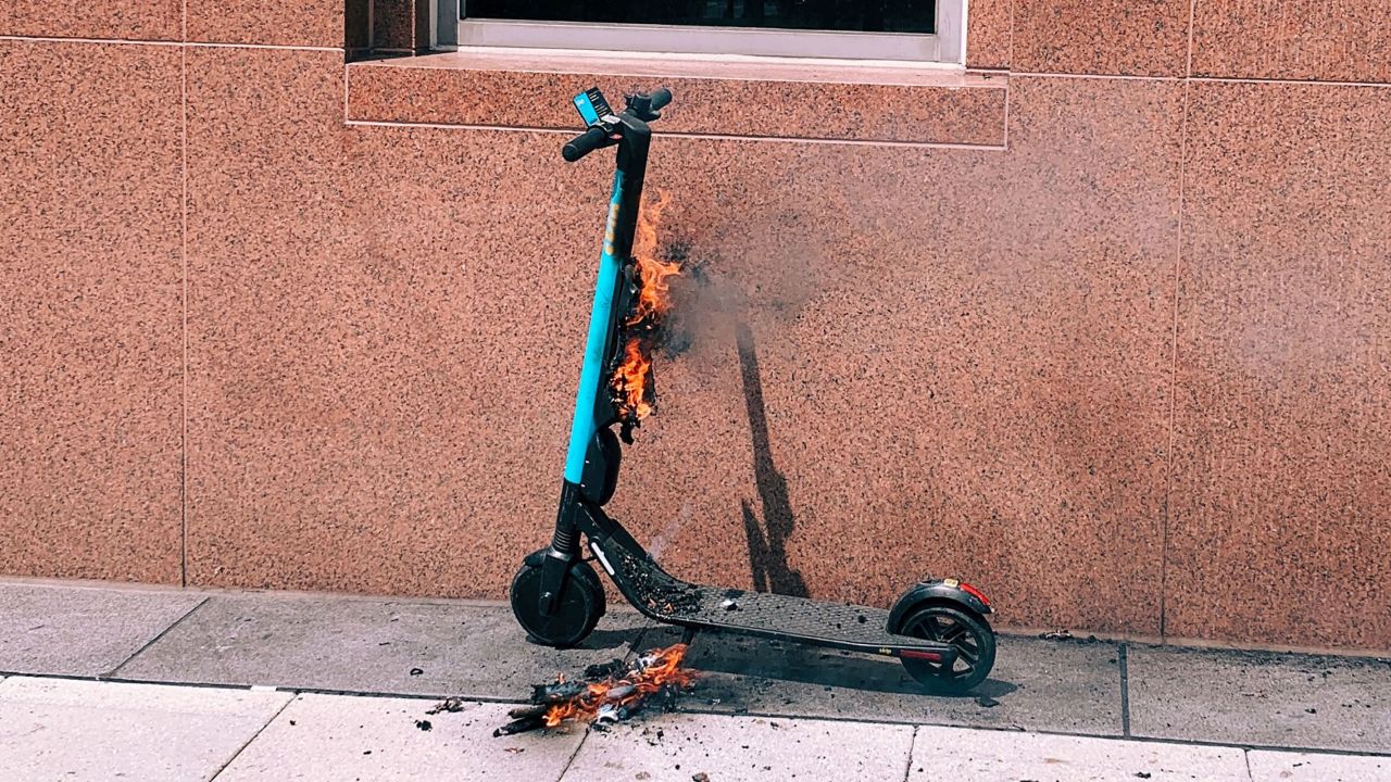 A Skip electric scooter on fire on the corner of 13th Street NW and I Street NW on May 30, 2019.