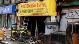 The charred remains of the e-bike repair and sales store on Madison St. in the Chinatown area of Manhattan early Tuesday.