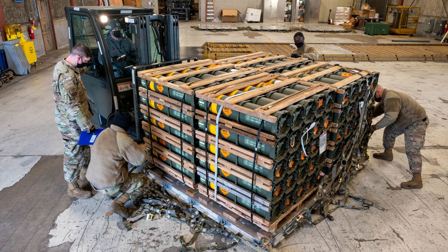 In this January 2022 photo, airmen and civilians from the 436th Aerial Port Squadron place ammunition, weapons and other equipment bound for Ukraine on a pallet at Dover Air Force Base, in Delaware.