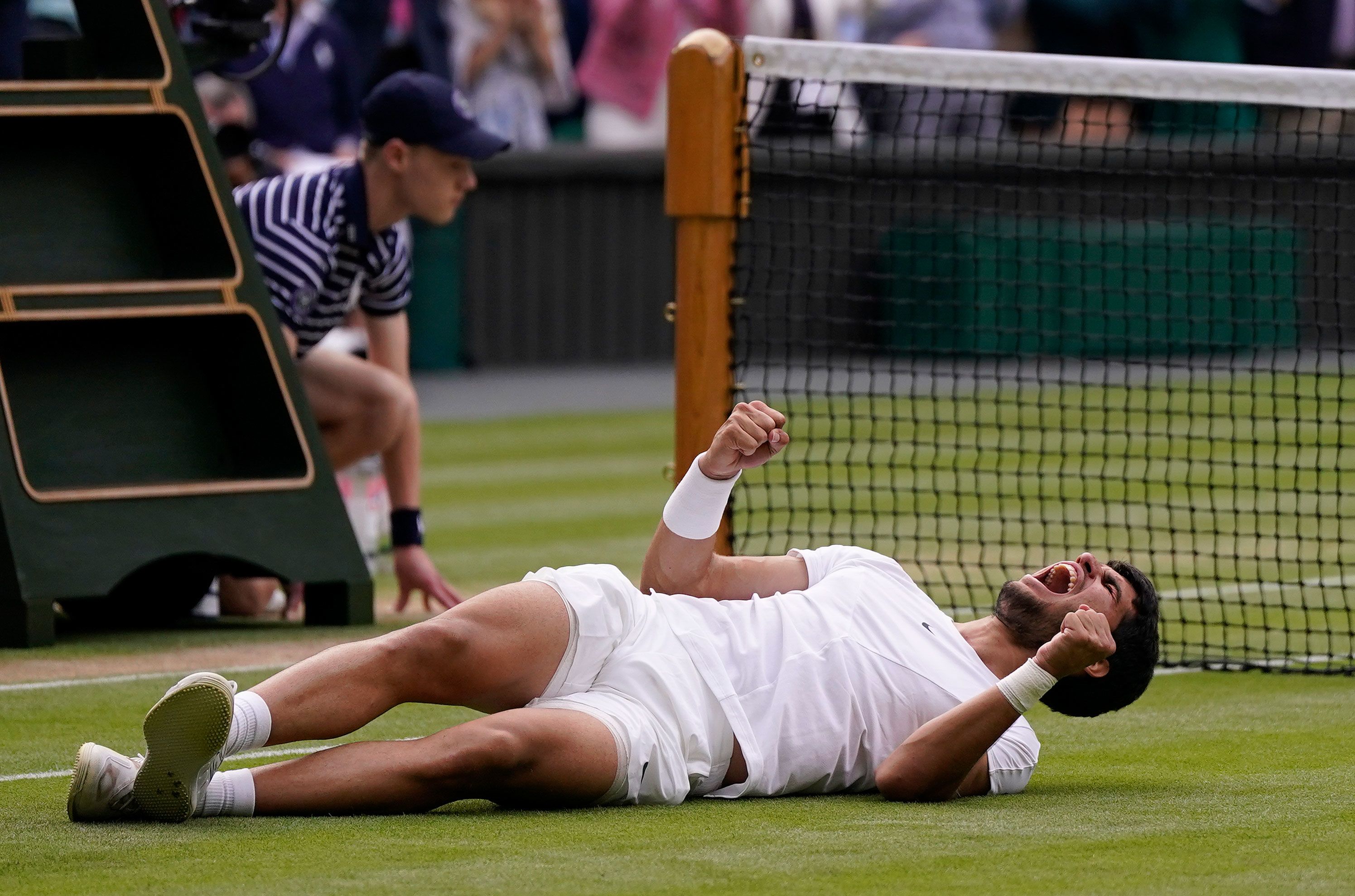 Carlos Alcaraz celebrates after winning Wimbledon.