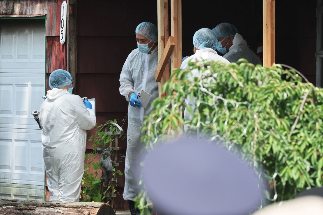 MASSAPEQUA PARK, NEW YORK - JULY 14: Law enforcement officials are seen as they investigate the home of a suspect arrested in the unsolved Gilgo Beach killings on July 14, 2023 in Massapequa Park, New York. A suspect in the Gilgo Beach killings was arrested in the unsolved case tied to at least 10 sets of human remains that were discovered since 2010 in suburban Long Island. The suspect Rex Heuermann is expected to be arraigned after his arrest Thursday night. A grand jury charged Heurmann with six counts of murder. The charges stem from the deaths of three of the four "Gilgo Four" women whose bodies were discovered along a stretch of Ocean Parkway in Long Island in 2010.  (Photo by Michael M. Santiago/Getty Images)