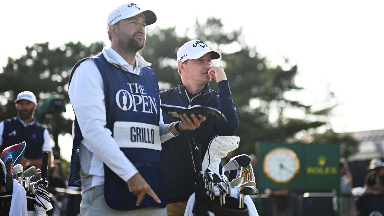 HOYLAKE, ENGLAND - JULY 20: Emiliano Grillo of Argentina looks on alongside caddy James Baker on the 18th hole during Day One of The 151st Open at Royal Liverpool Golf Club on July 20, 2023 in Hoylake, England. (Photo by Oisin Keniry/R&A/R&A via Getty Images)