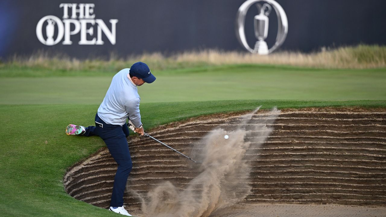HOYLAKE, ENGLAND - JULY 20: Rory McIlroy of Northern Ireland plays his shot from the bunker on the 18th green during Day One of The 151st Open at Royal Liverpool Golf Club on July 20, 2023 in Hoylake, England. (Photo by Richard Heathcote/R&A/R&A via Getty Images)
