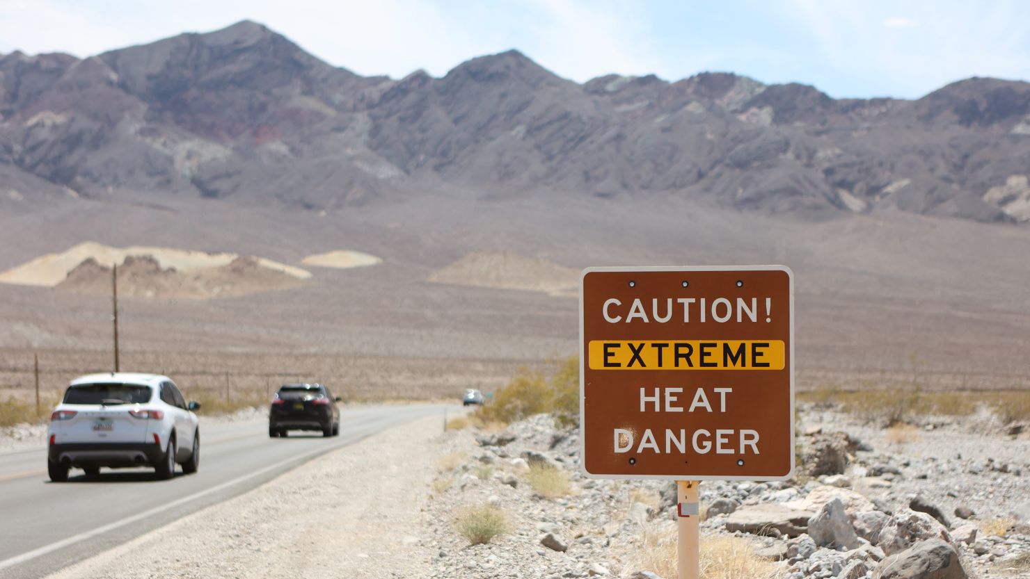 A heat advisory sign is shown along Highway 190 during a heat wave in Death Valley National Park in Death Valley, California. 