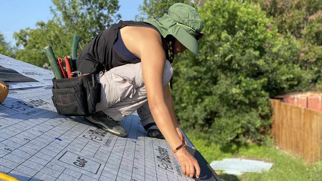 Zeyla Alcantara of New Braunfels-based Roofer Chicks works on a roof in late May in Texas.