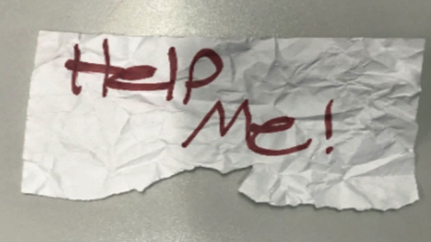 Kidnapping victim's "Help Me!" sign