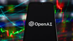 POLAND - 2023/07/06: In this photo illustration, an OpenAi logo displayed on a smartphone with stock market percentages in the background. (Photo Illustration by Omar Marques/SOPA Images/LightRocket via Getty Images)