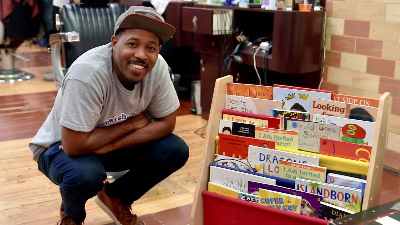 Fresh looks and new books: He’s helping young boys hone their love of reading every time they go to the barbershop | CNN