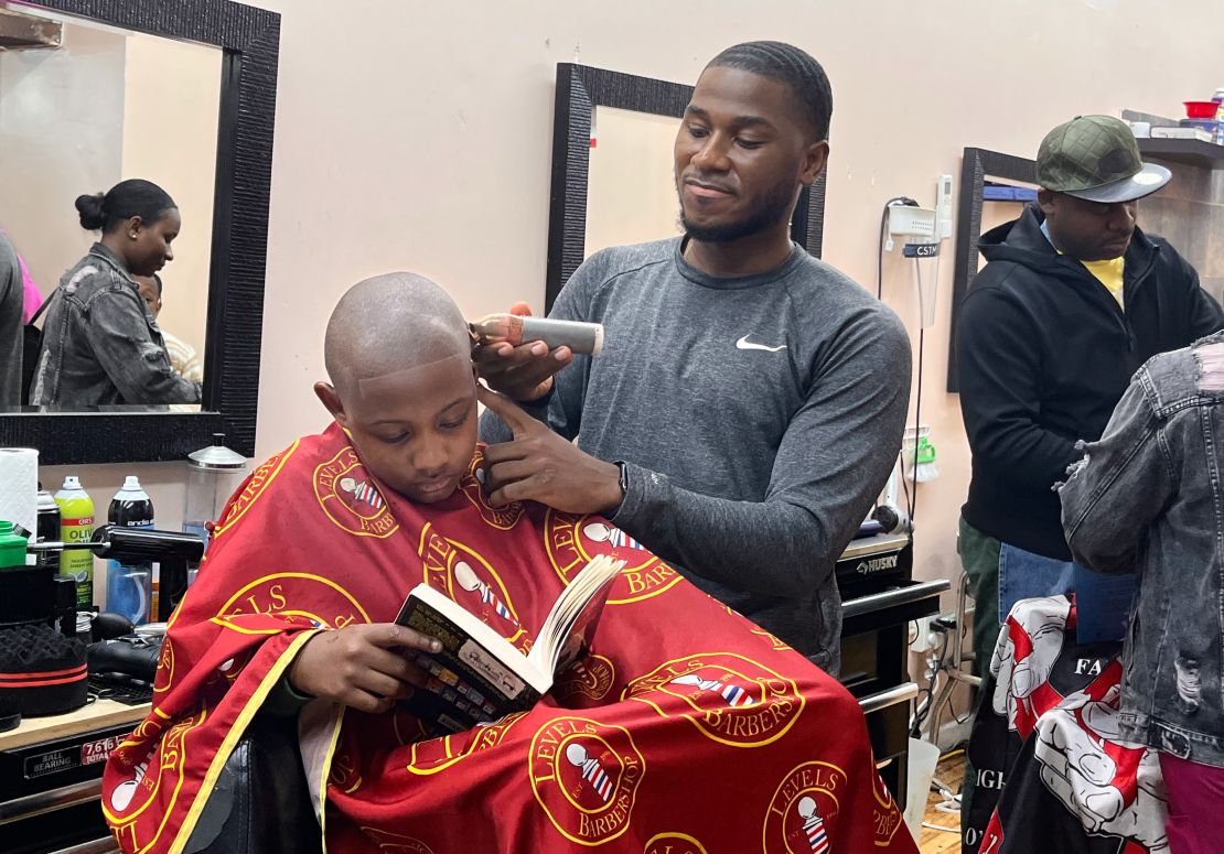 Barbershops put books in hands of kids getting haircuts