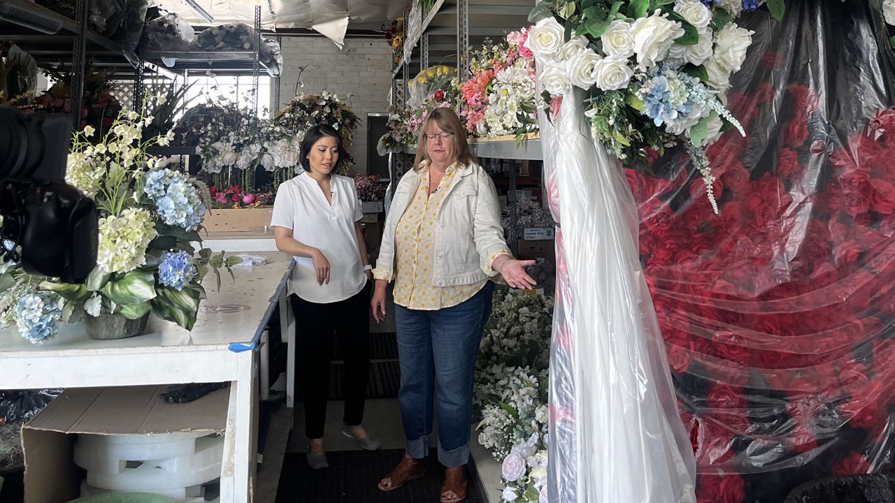 Corri Levelle, owner of Sandy Rose Floral, shows CNN around her warehouse on June 28.