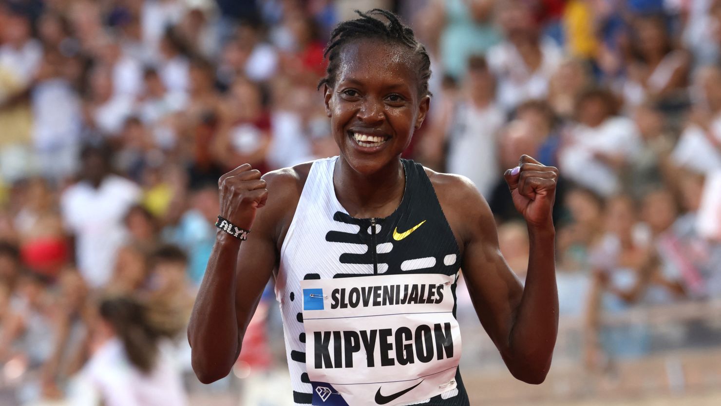 Kenya's Faith Kipyegon celebrates after winning the women's 1 mile final and setting a new world record.